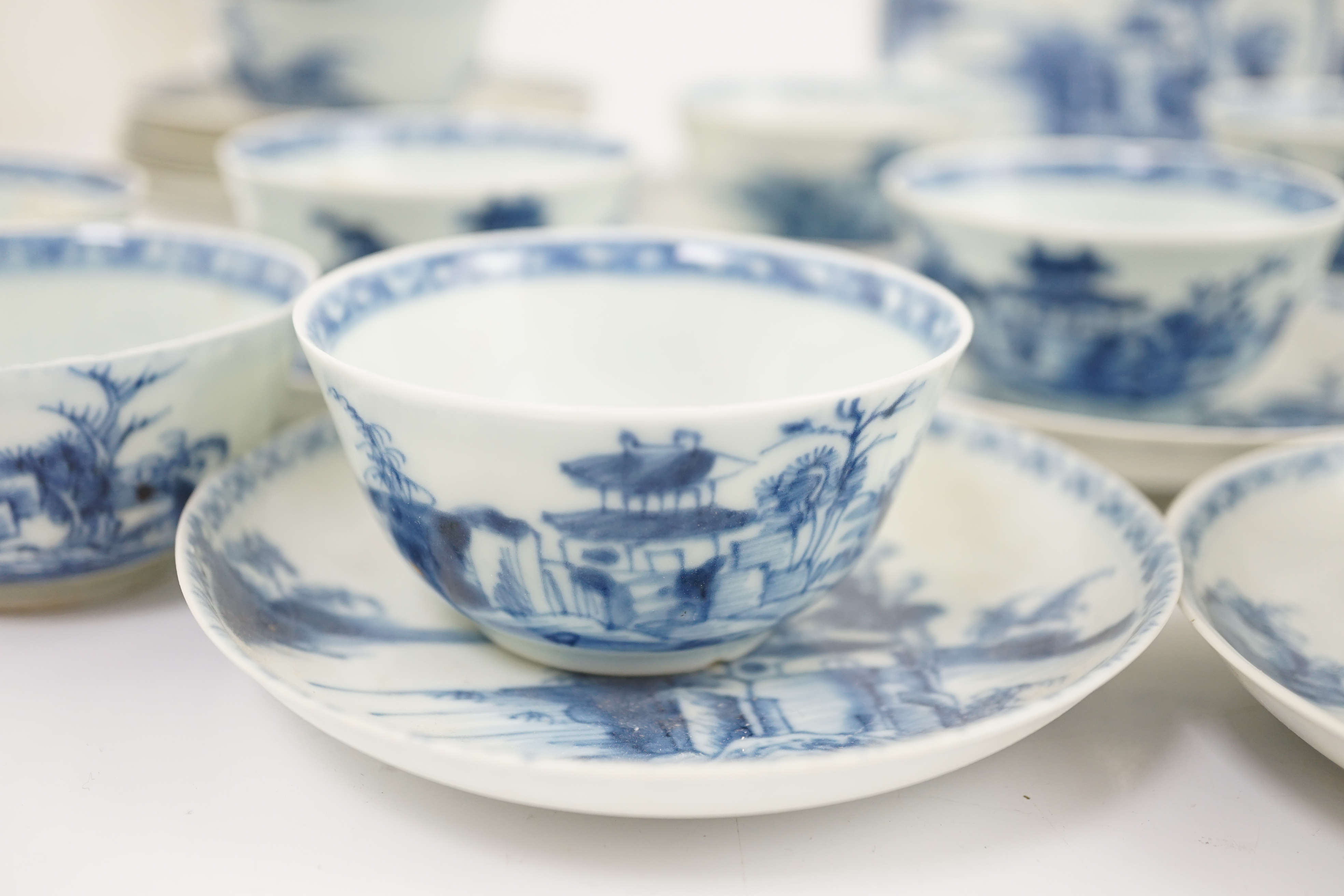 A set of twenty four Chinese Nanking Cargo blue and white ‘large pagoda’ tea bowls and saucers, Qianlong period